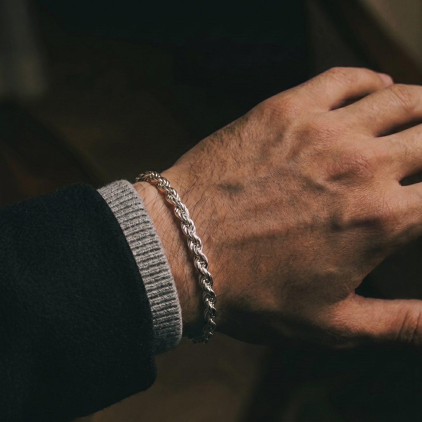 Helix Rope silver bracelet worn on the wrist, close up