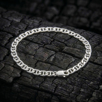 Voyager Anchor bracelet in solid 925 sterling silver on charred oak