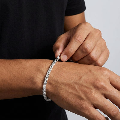 Fastening the lobster clasp on the Anvil Weave bracelet