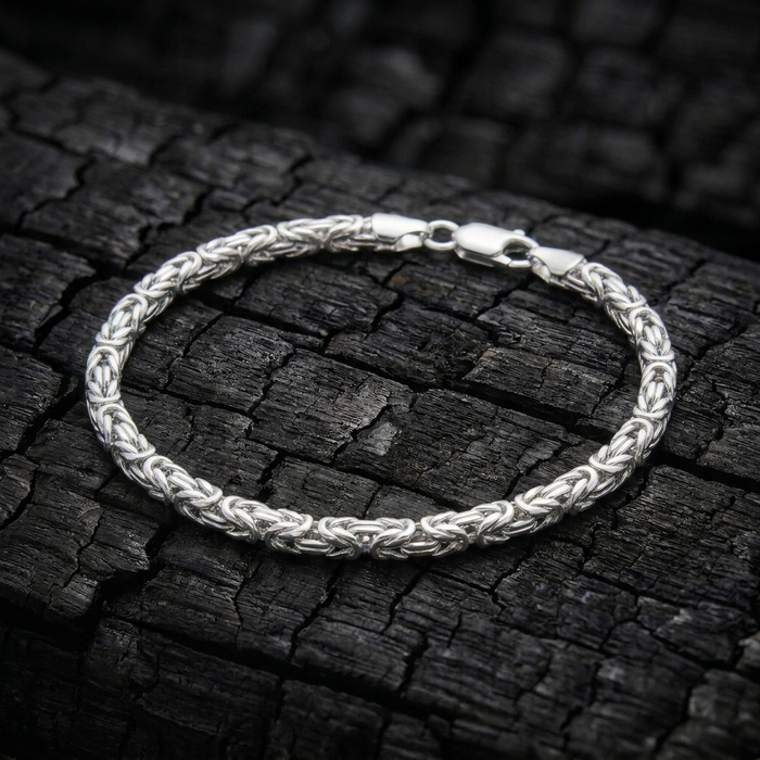 Anvil Weave bracelet in solid 925 sterling silver on charred oak