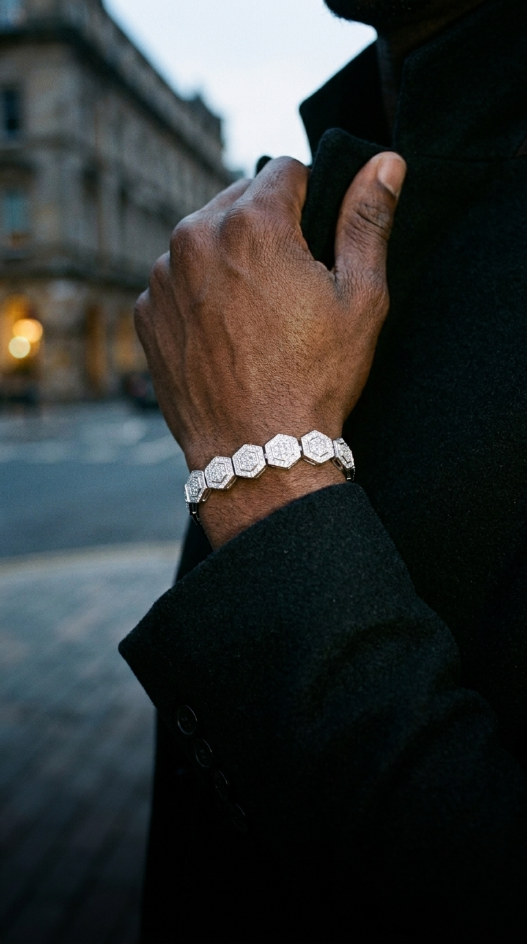 Man in a dark coat wearing an After Hours moissanite bracelet