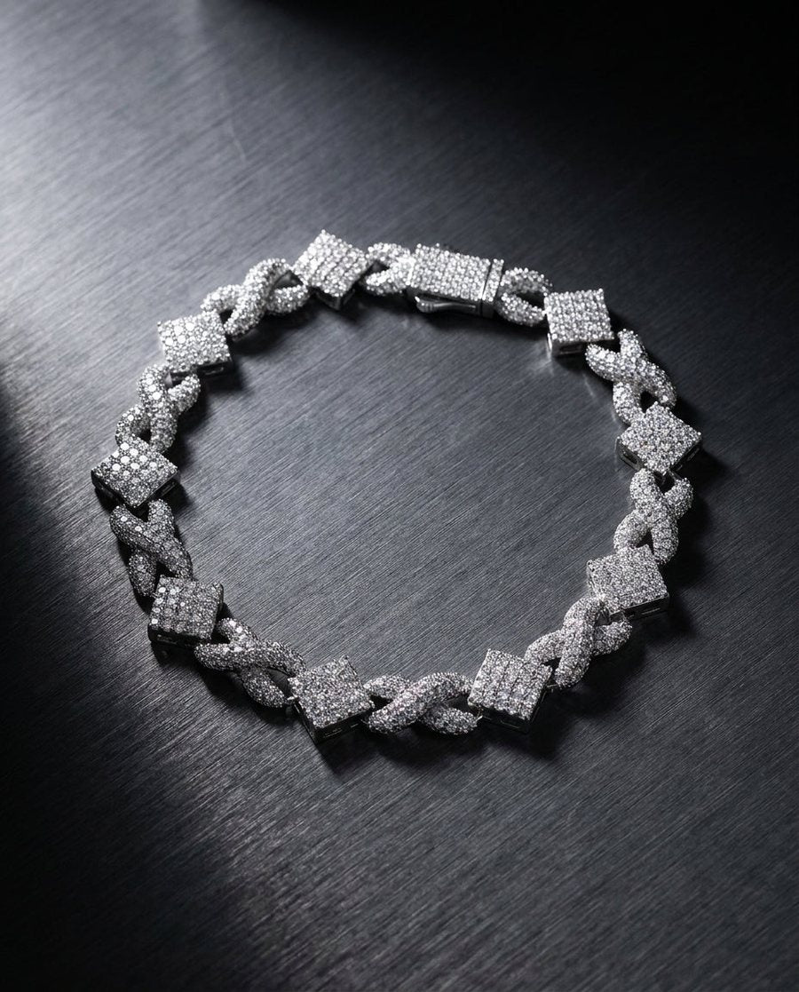 Infinity-link moissanite bracelet in silver on dark slate